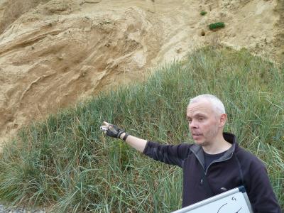 Scientist interpreting Ice Age deposits in the field